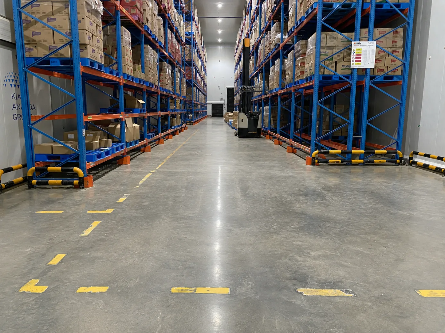 Active logistics aisle with storage racking and a finished concrete floor