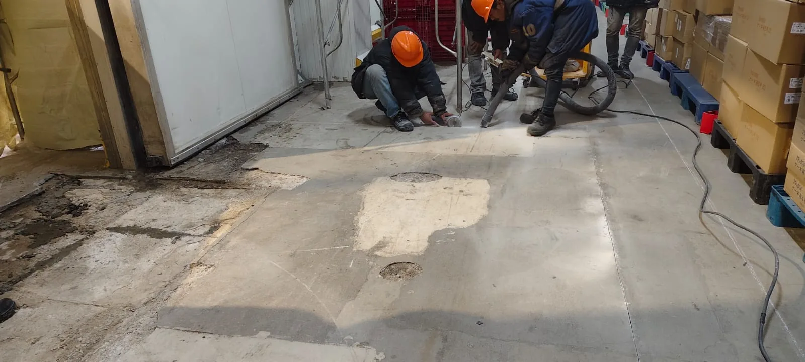 Ultrafloor crew working inside a cold storage room