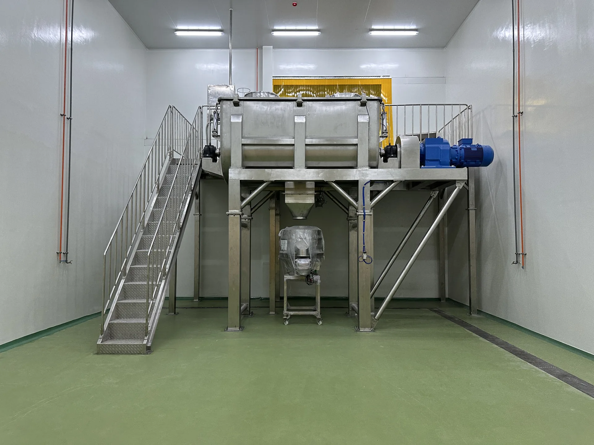 Protective industrial floor surrounding stainless-steel processing equipment