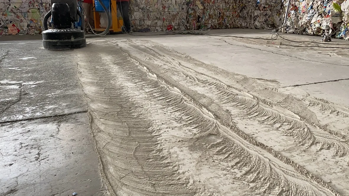 Industrial concrete floor during mechanical surface restoration